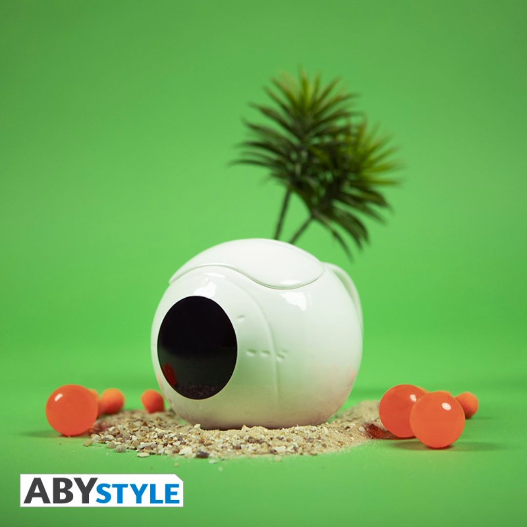 ABYstyle Dragon Ball Z 3D ceramic mug shaped like Vegeta’s Saiyan space pod, displayed on sand with orange Dragon Balls and a palm tree, collectible anime merchandise.