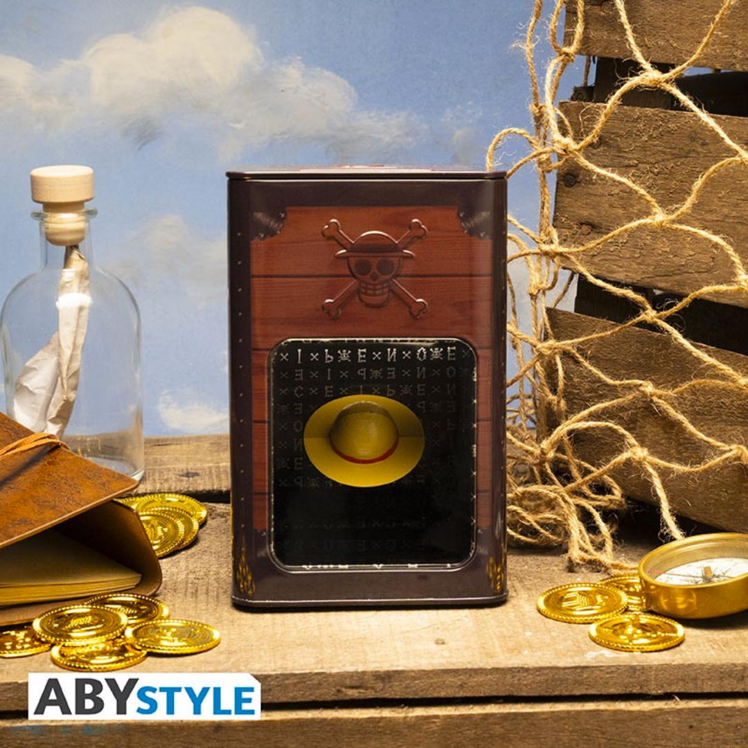 One Piece money bank with a treasure chest design, featuring Luffy's straw hat and a skull emblem, surrounded by gold coins and nautical elements.