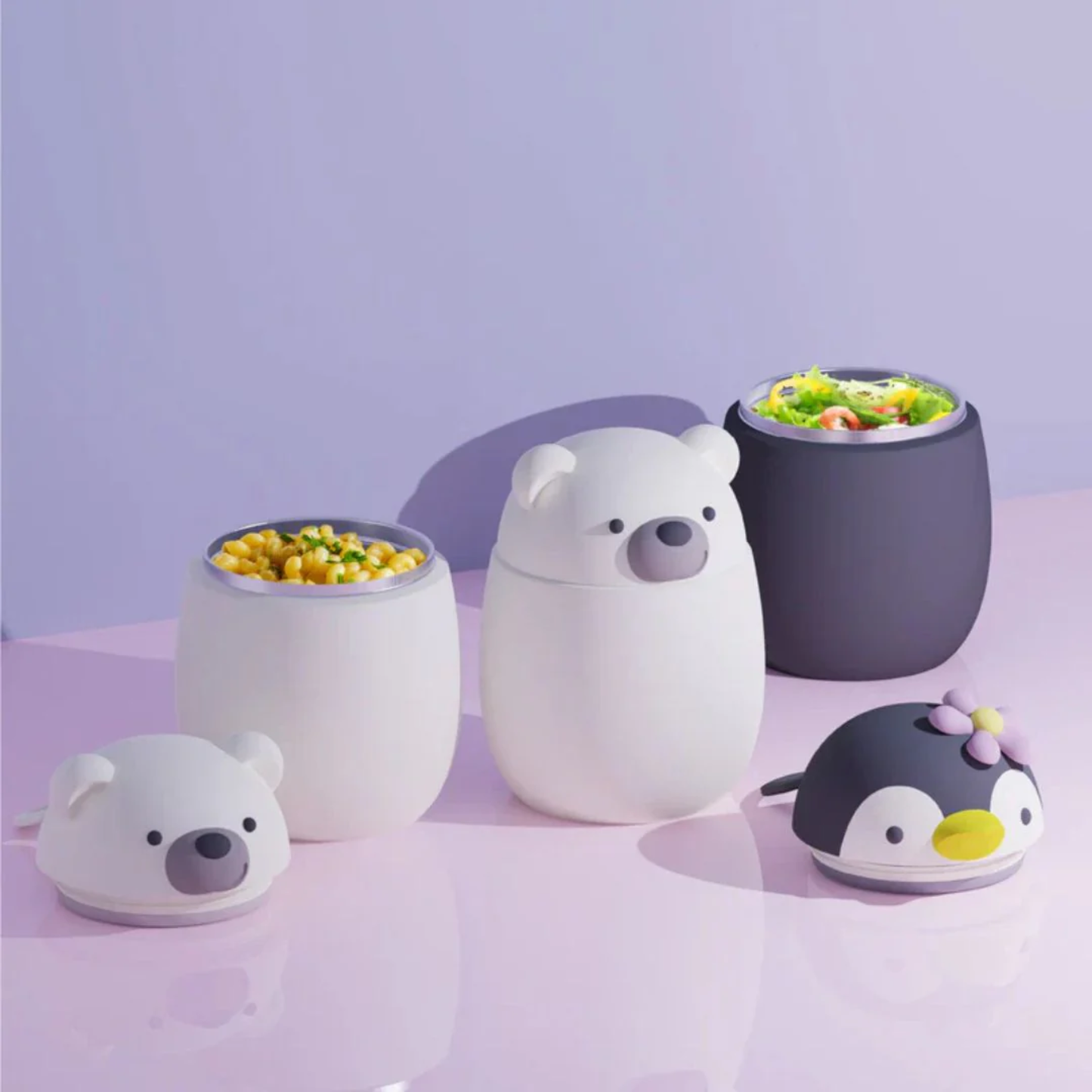 Asobu Bestie vacuum insulated stainless steel food containers in bear and penguin designs, 600ml, shown with salad and corn, ideal for kids and meal prep