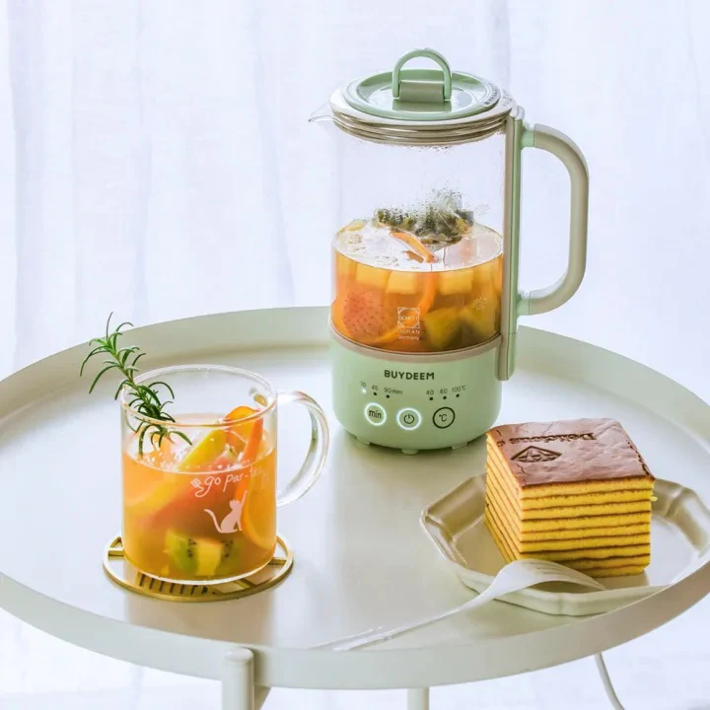 Buydeem Mini Health Pot Kettle Cooker with fruit tea and layered cake, compact glass kettle perfect for healthy breakfast and drinks