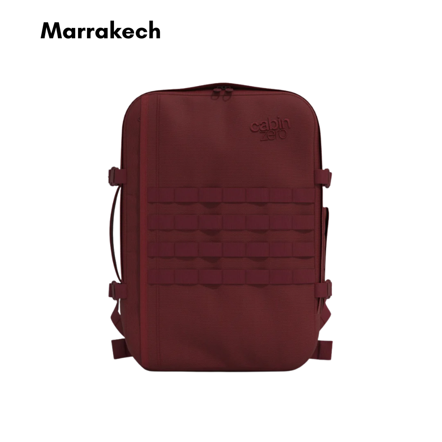 CabinZero Military Backpack 28L Marrakech, deep red tactical travel backpack with MOLLE webbing and compression straps, designed for outdoor and everyday adventures