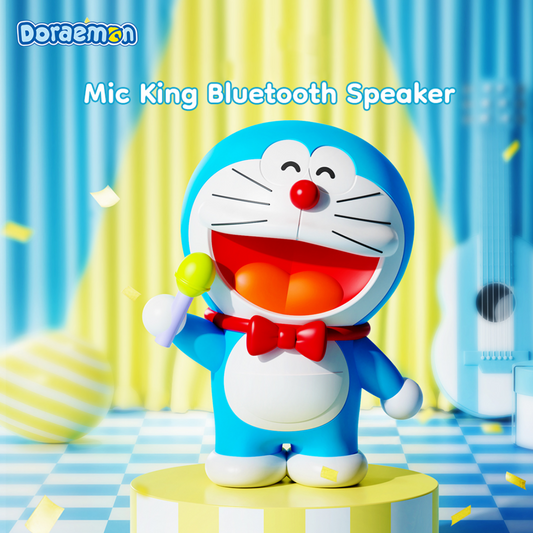Doraemon Mic King Bluetooth Speaker featuring a smiling Doraemon figure holding a yellow microphone, displayed on a colorful stage with musical decorations