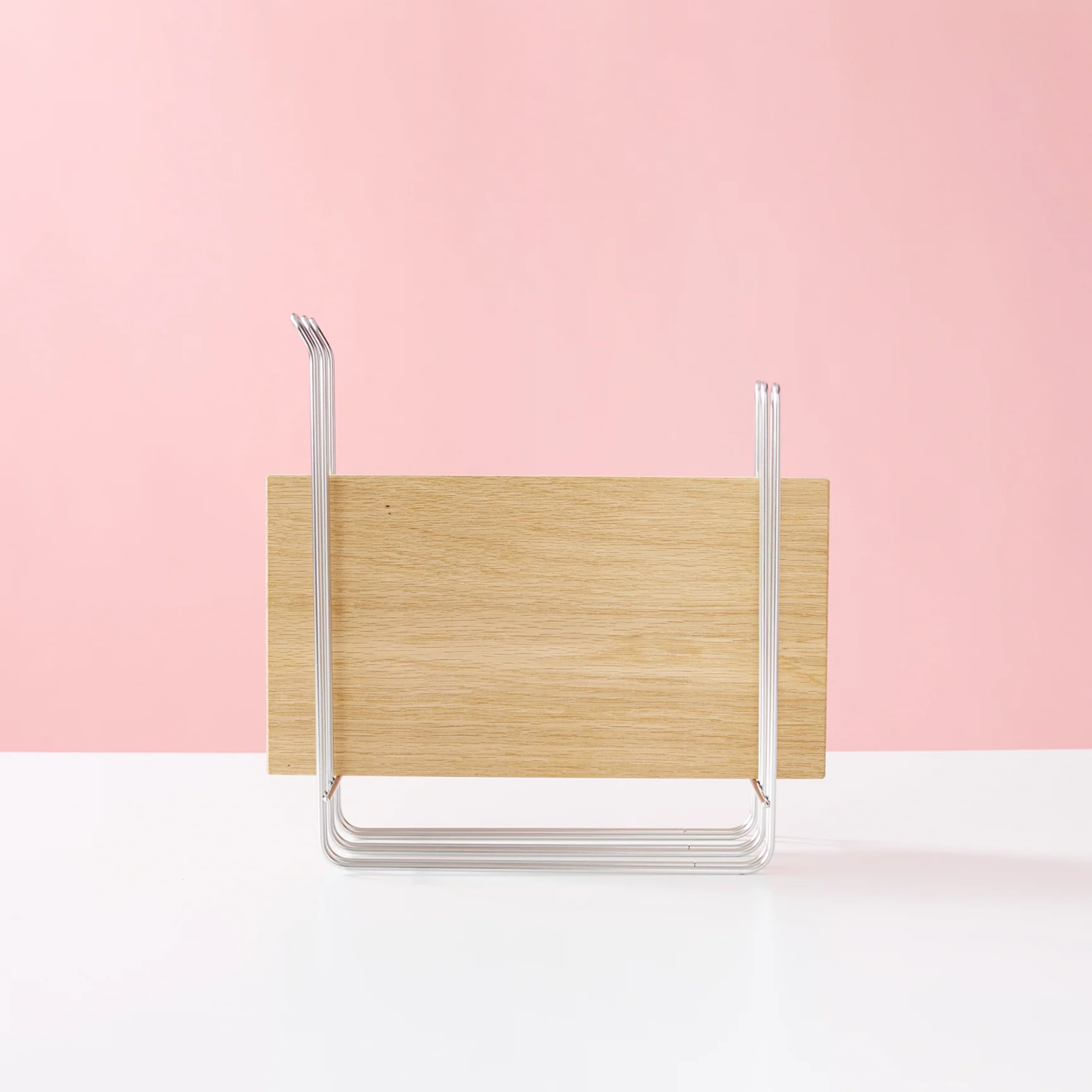 Hanauta stainless steel kitchen rack hanger used as a cutting board holder, space-saving organiser for modern kitchen countertops.