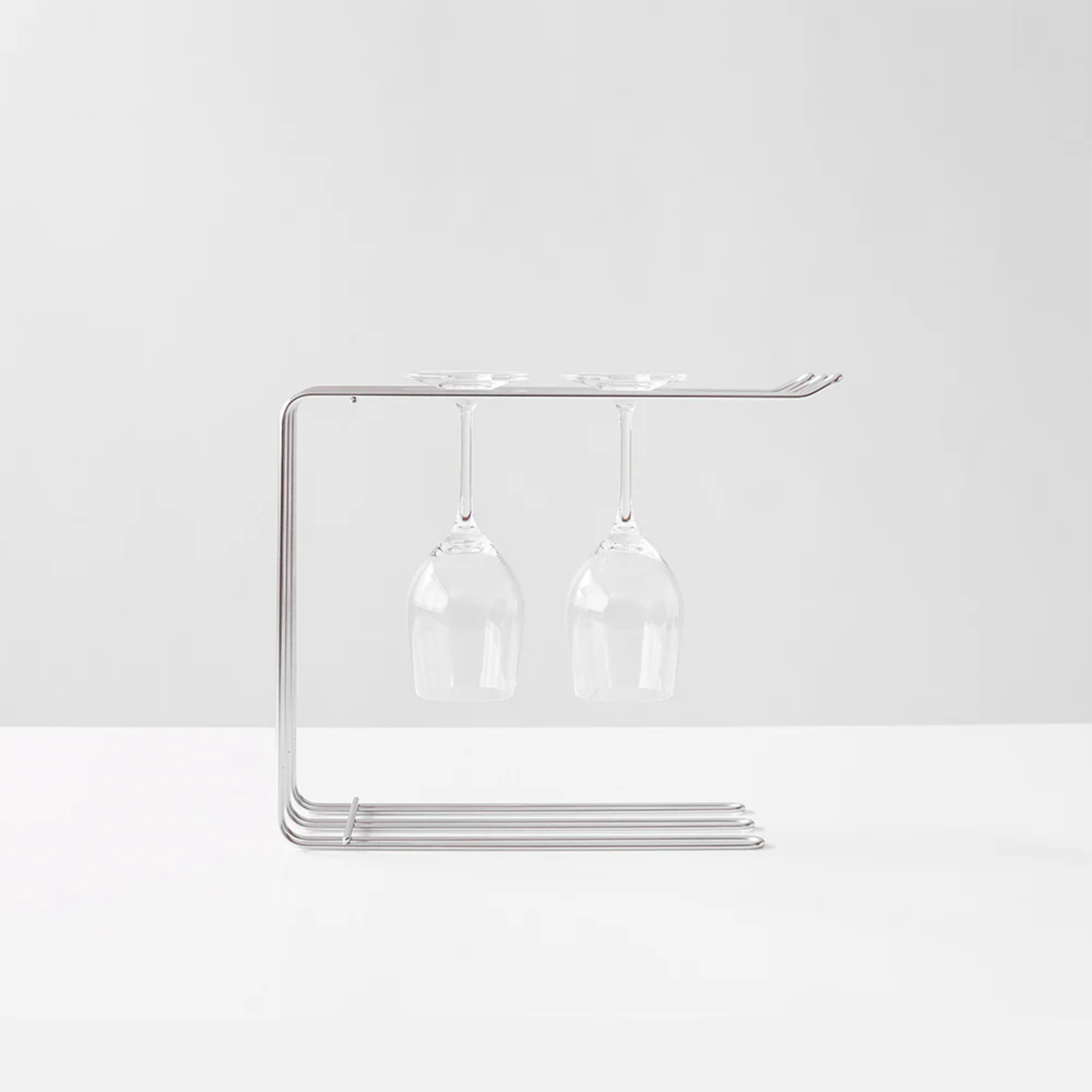 Hanauta stainless steel kitchen rack hanger holding wine glasses, modern space-saving drying rack and sink organiser for kitchen accessories.