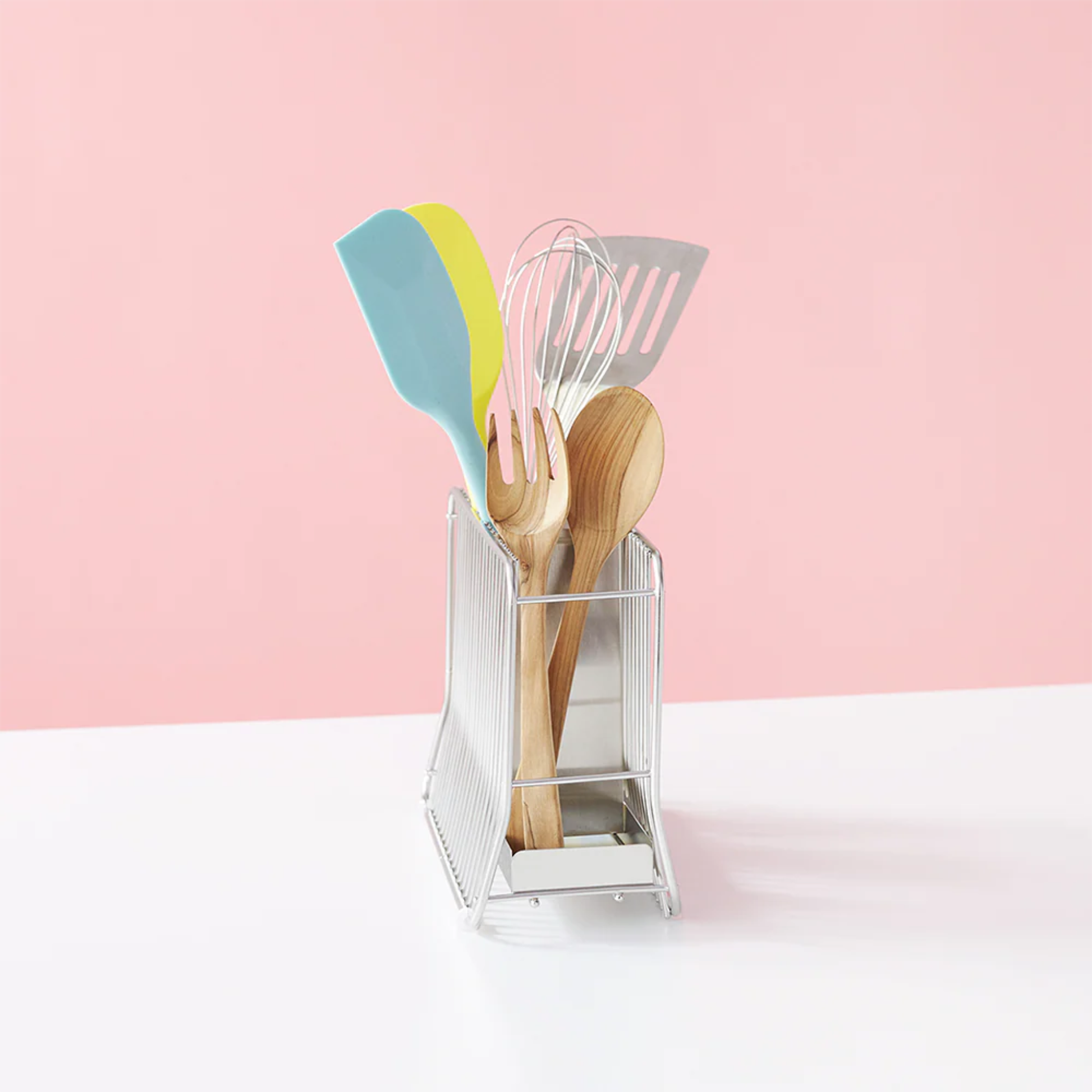 Hanauta stainless steel kitchen rack in vertical position, neatly organising spatulas, whisks, and wooden utensils for efficient countertop storage