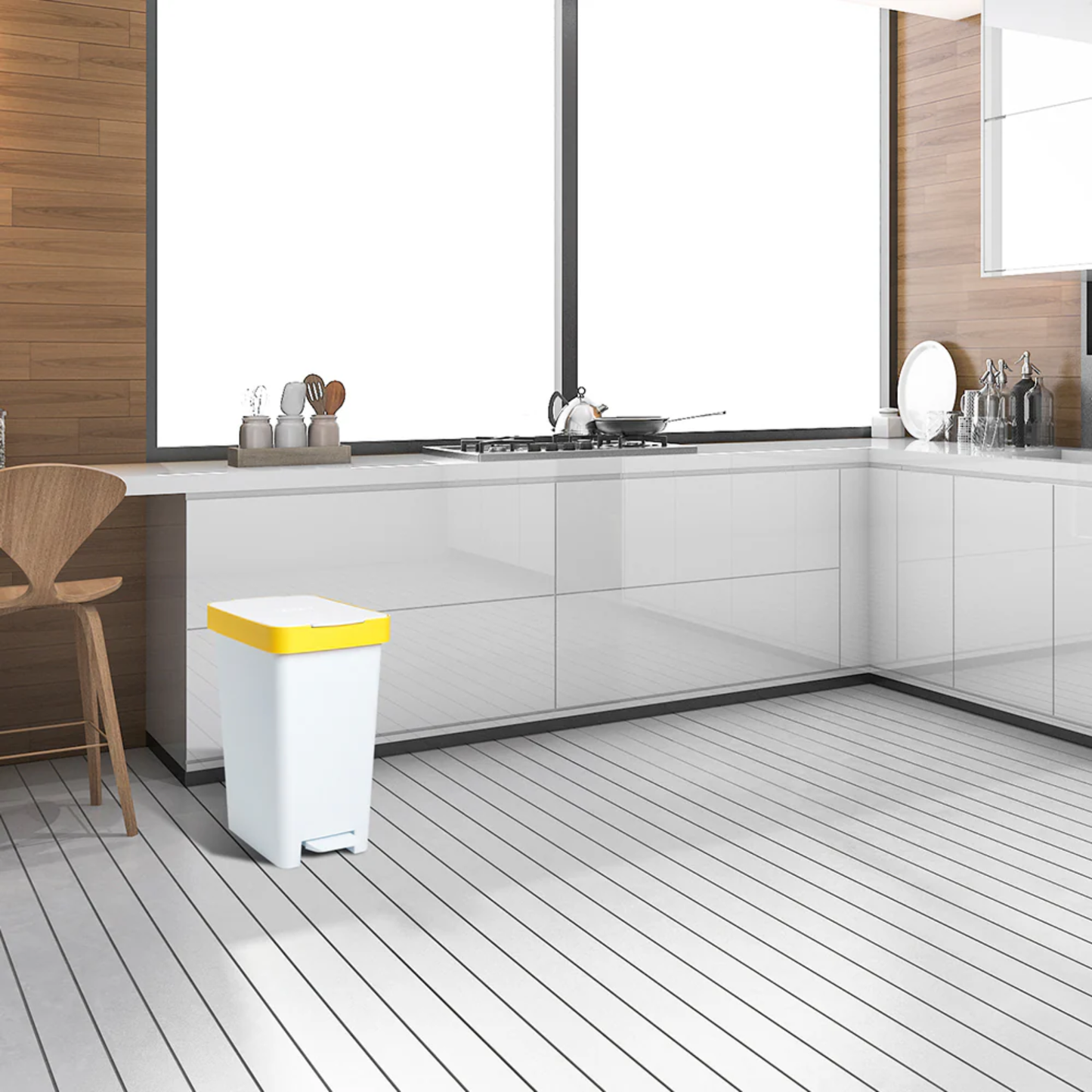 Modern white kitchen interior with Tatay 25L smart pedal bin featuring yellow lid for hygienic hands‑free rubbish disposal.
