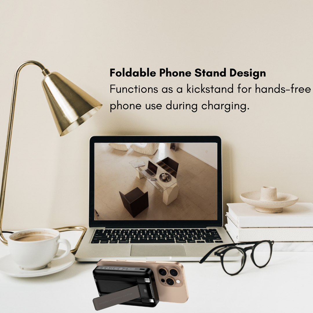 Black WiWU magnetic power bank attached to the back of a gold iPhone, foldable stand extended for hands-free charging on a desk