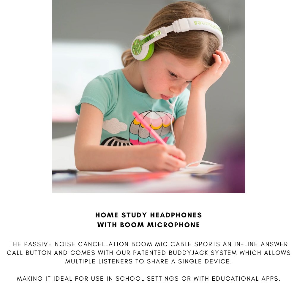 Young girl with light brown hair wearing white and green over-ear headphones, sitting at a desk and writing in a notebook, dressed in a turquoise shirt with a colorful owl design; studying in a bright indoor setting