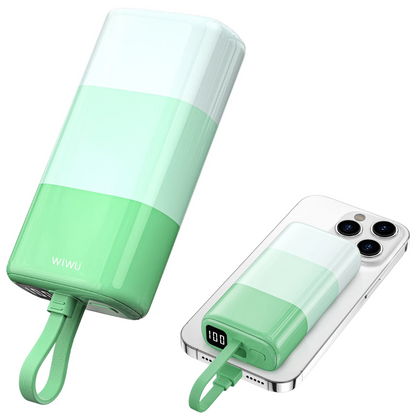 Pastel green WiWU power banks in two positions—one vertical, one horizontal—charging an iPhone using built-in cable, with LED display showing 100% battery power and visible power on/off button.