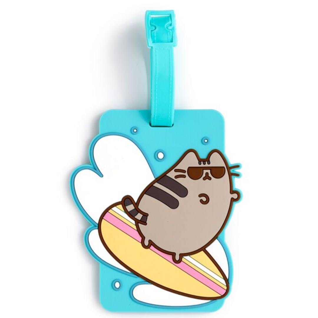 PUCKATOR Pusheen the Cat Summer Surfer PVC Luggage Tag in pink and turquoise, featuring Pusheen on a surfboard with palm tree background.