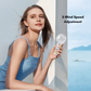 Lady holding a compact portable fan with three customizable wind speed settings, perfect for on-the-go cooling.