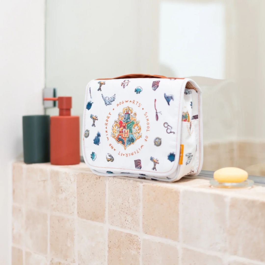 Official Harry Potter Hogwarts Toiletry Bag by Travelmall with hanging hook, zippered compartments, and carry handle – compact and foldable travel organizer.