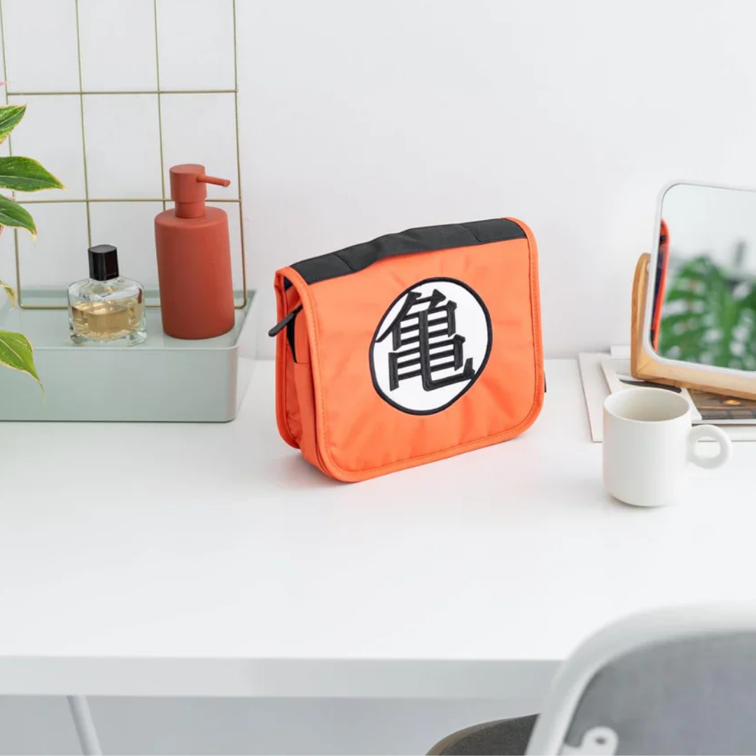 Dragon Ball Z Kame Toiletry Organizer Bag – Orange foldable travel storage pouch with Goku’s symbol, built-in hook, mesh pockets & zippered compartments.