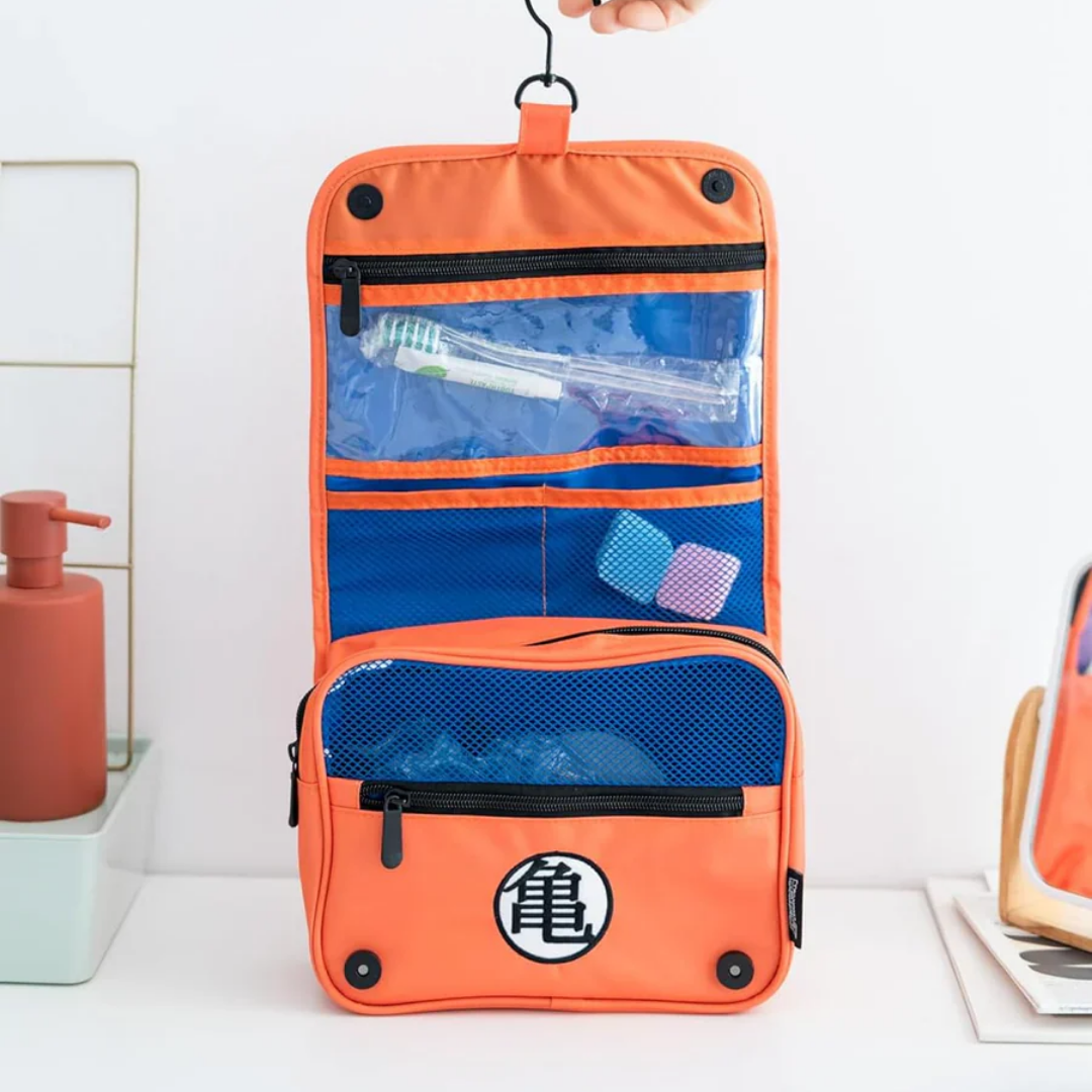Dragon Ball Z Kame Toiletry Organizer Bag – Orange foldable travel storage pouch with Goku’s symbol, built-in hook, mesh pockets & zippered compartments.