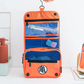 Dragon Ball Z Kame Toiletry Organizer Bag – Orange foldable travel storage pouch with Goku’s symbol, built-in hook, mesh pockets & zippered compartments.