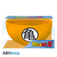 ABYstyle Dragon Ball Z orange bowl featuring the black "gui" kanji symbol on the front, shown in retail packaging with Dragon Ball Z logo and red star pattern along the inner rim.
