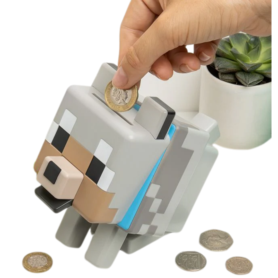 Minecraft Wolf money bank standing on a gaming desk next to a monitor