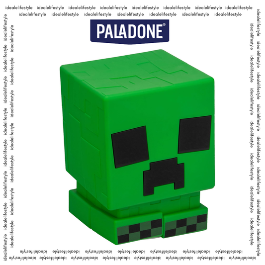 Paladone Minecraft Creeper SquishyGlo glowing green on a dark bedside table