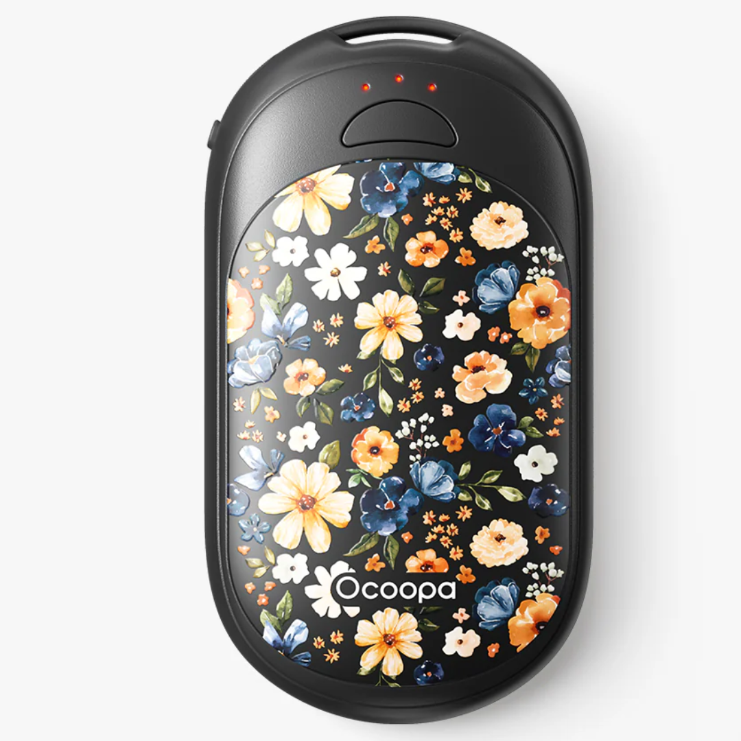 Ultra-slim 1.8cm Ocoopa hand warmer slipping into a winter glove-Flower