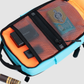 Bold Mimic Sling Bag in turquoise, open view showing mesh pocket organizer with tech gadgets and essentials; smart, versatile interior storage design.