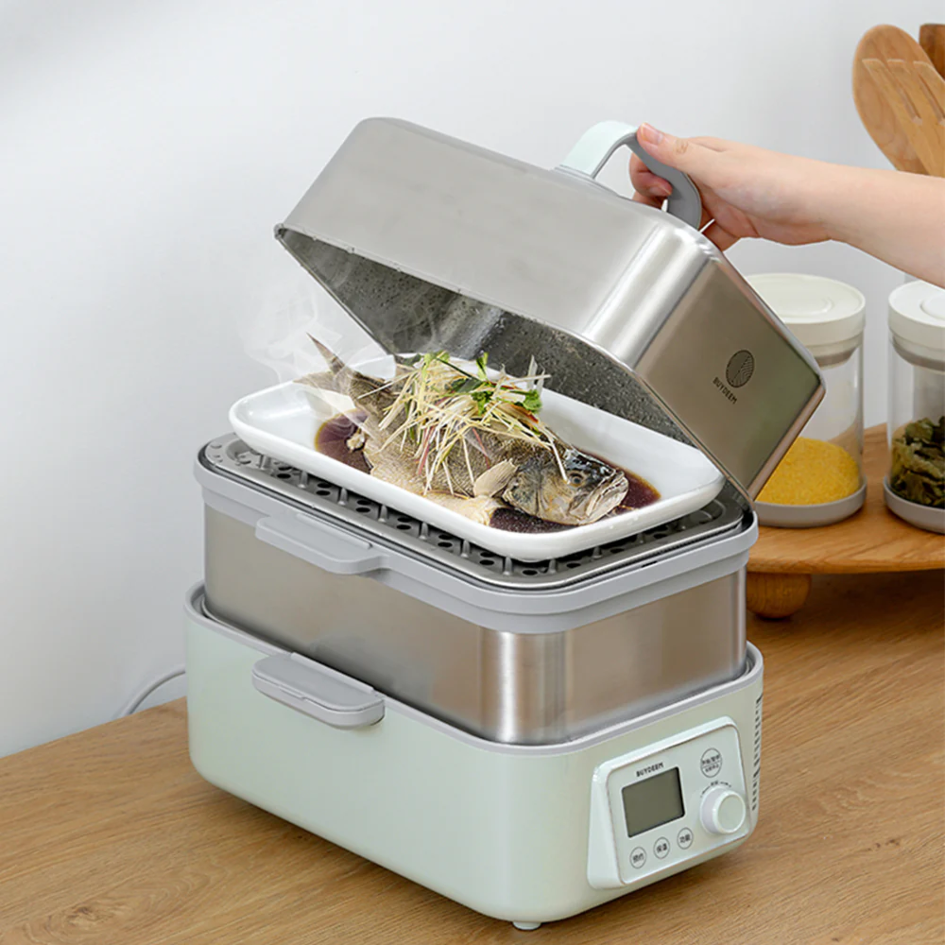 Buydeem health pot steamer cooking steamed fish demonstration, showing stainless steel multifunction appliance with digital controls for easy healthy meal preparation