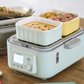 Buydeem multifunction steamer and health pot cooking eggs and shrimp in separate ceramic trays, featuring smart timer and digital controls for nutritious meals