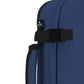 Close-up of CabinZero Classic Tech Bag 28L in Navy Blue showing compression strap, Tracer tag, and padded side handle for secure and comfortable carrying on travel or day-to-day use.