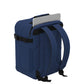CabinZero Classic Tech Bag 28L in Navy Blue showing dedicated rear laptop compartment and padded shoulder straps for safe tech storage and comfortable commuting or travel