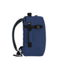 Side view of CabinZero Classic Tech Bag 28L in Navy Blue highlighting padded side handle, compression strap, and Tracer tag—designed for secure, comfortable, and versatile carry during travel or daily commutes.