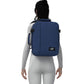Woman wearing CabinZero Classic Tech Bag 28L in Navy Blue, highlighting padded shoulder straps and ergonomic fit—ideal backpack for stylish commuters, travelers, and daily tech organization