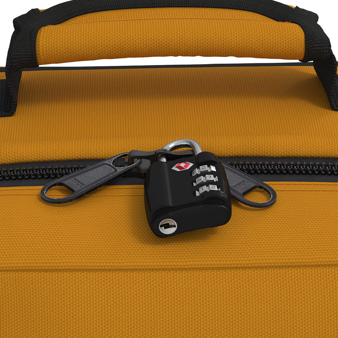 Close-up of CabinZero Classic Tech Bag 28L in Orange Chill featuring lockable YKK zippers secured with a TSA-approved travel lock for added security during commutes and trips