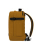 Profile view of CabinZero Classic Tech Bag 28L in Orange Chill showing slim shape, adjustable compression strap, and ergonomic shoulder straps—ideal for tech commuters and efficient travel organization