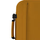 Detail view of CabinZero Classic Tech Bag 28L in Orange Chill highlighting the padded side handle and compression strap for flexible, comfortable carrying on the go