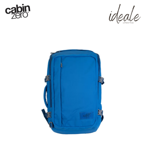 CabinZero ADV 32L Atlantic Blue travel backpack front view, made from water-resistant 500D nylon ripstop, featuring side compression straps, quick access front zip pocket, padded laptop sleeve, airflow back panel, and top handle for urban and adventure travel, shown with CabinZero and Ideale Lifestyle branding.