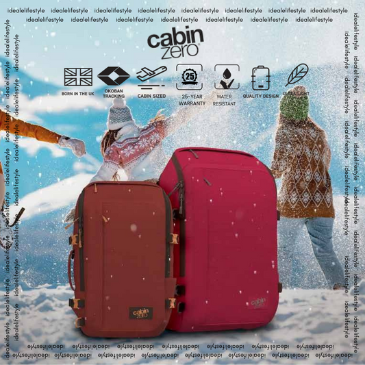 CabinZero ADV 42l travel backpacks in red and burgundy showcased in winter snow, featuring 25-year warranty, Okoban tracking, ultralight and water-resistant design, available at Ideale Lifestyle