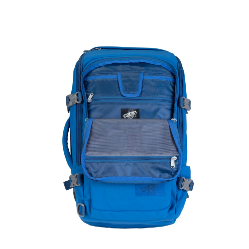 CabinZero ADV Pro 32L backpack in blue with open front organizer pockets and mesh compartments for travel essentials