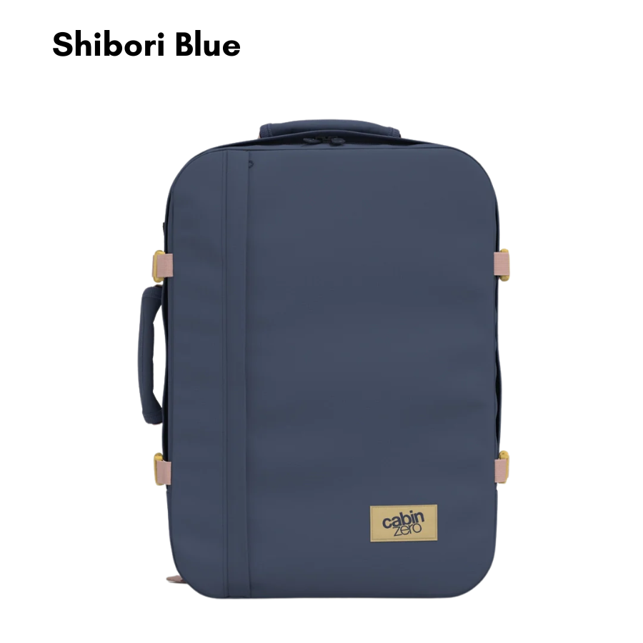 Shibori Blue CabinZero Classic 36L travel bag, spacious navy blue carry-on backpack with beige accents for flights and weekend trips