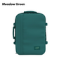 CabinZero Classic 44L travel cabin bag in Meadow Green color, ideale lifestyle product image for fresh outdoor-inspired travel