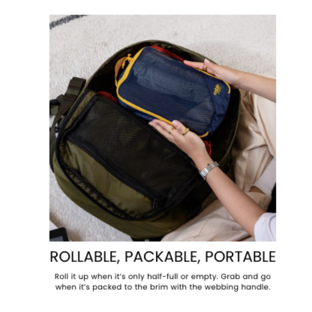 CabinZero CLASSIC PACKING CUBE Large Blue Shimmer—packable, rollable, portable mesh window organizer shown packed for travel convenience.