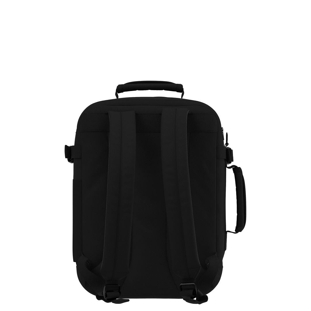 Back view of CabinZero Classic Tech Bag 28L in Absolute Black featuring padded adjustable shoulder straps, top handle, and side handle for ergonomic travel and all-day comfort.