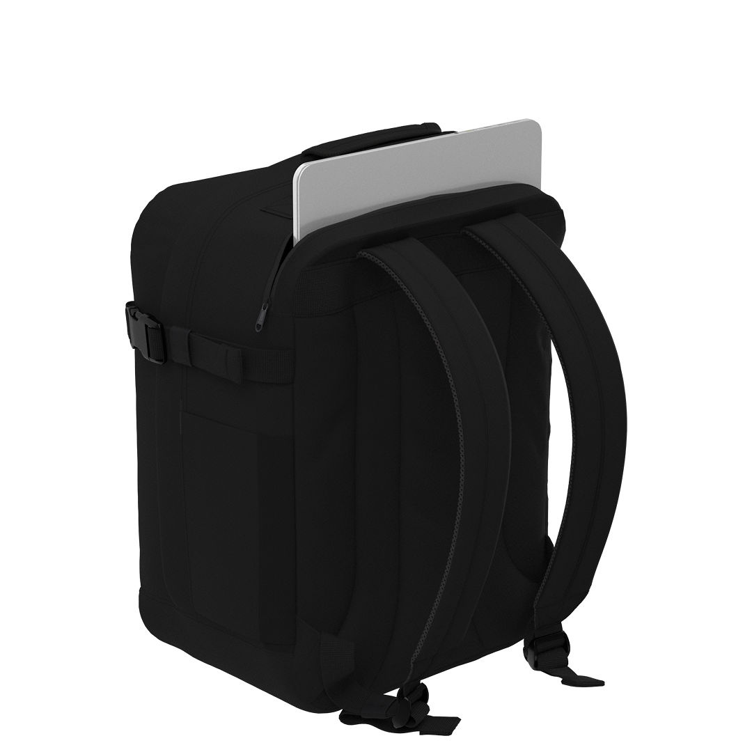 CabinZero Classic Tech Bag 28L in Absolute Black showing padded rear laptop compartment, designed for secure and convenient tech storage for travel and daily commuting.
