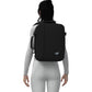 Woman wearing CabinZero Classic Tech Bag 28L in Absolute Black, showcasing ergonomic design and padded straps—ideal backpack for travel, work, and everyday commuting.