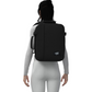 Woman wearing CabinZero Classic Tech Bag 28L in Absolute Black—lightweight travel backpack with laptop sleeve, ideal for commuting, tech gear, and everyday use
