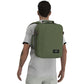 Man wearing CabinZero Classic Tech Bag 28L in Georgian Khaki, featuring ergonomic shoulder straps and minimalist design—ideal backpack for tech-savvy travelers, commuting, and everyday use