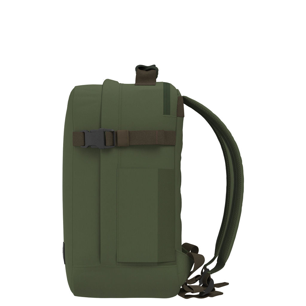 Profile view of CabinZero Classic Tech Bag 28L in Georgian Khaki showing slim design, compression strap, and side pocket—perfect for commuting, travel, and tech gear organization.