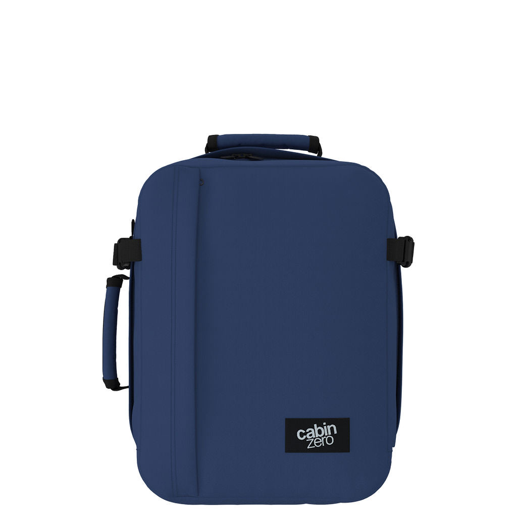 Front view of CabinZero Classic Tech Bag 28L in Navy Blue featuring minimalist structure, padded handles, and compact design—perfect backpack for travel, work, and tech gear essentials.