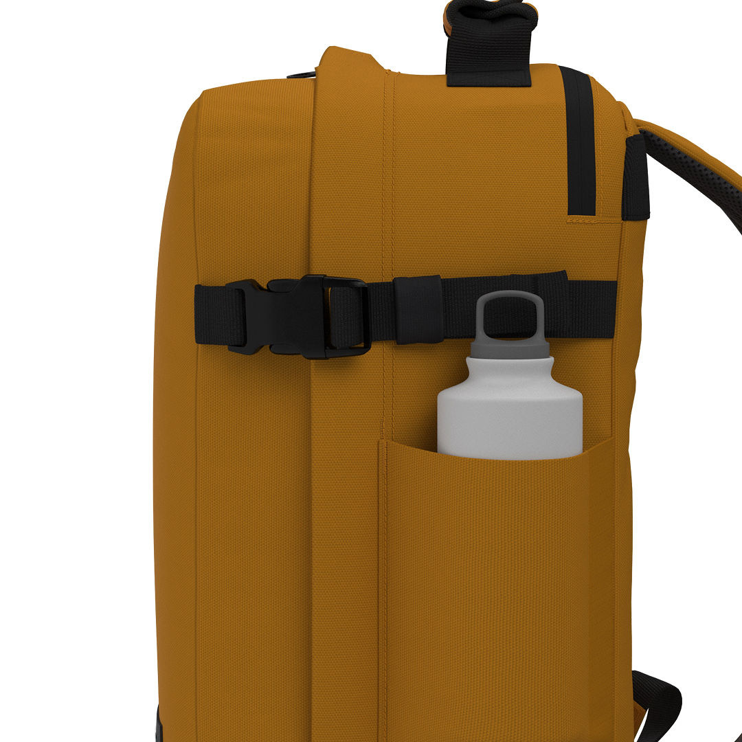 CabinZero Classic Tech Bag 28L in Orange Chill featuring side water bottle pocket and compression strap—functional travel backpack for daily hydration and convenience.