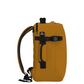 Side view of CabinZero Classic Tech Bag 28L in Orange Chill highlighting adjustable compression straps, padded side handle, and ergonomic shoulder straps for comfortable travel and daily use.