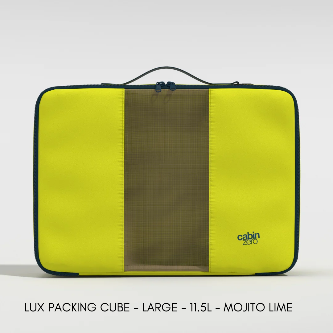 Front view of a large CabinZero Lux Packing Cube in Mojito Lime, featuring a bright yellow-green body, central mesh panel, double zipper closure, top handle, and CabinZero logo in the lower right corner.