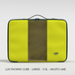 Front view of a large CabinZero Lux Packing Cube in Mojito Lime, featuring a bright yellow-green body, central mesh panel, double zipper closure, top handle, and CabinZero logo in the lower right corner.